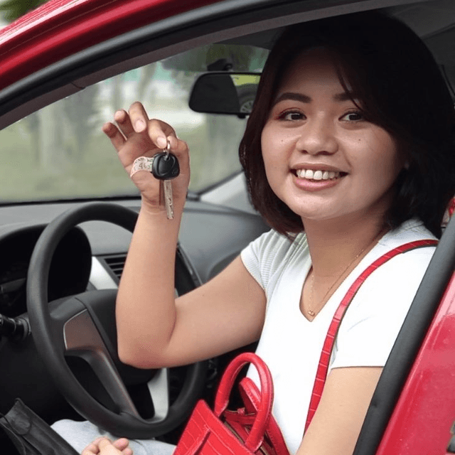 A girl with a car-key.